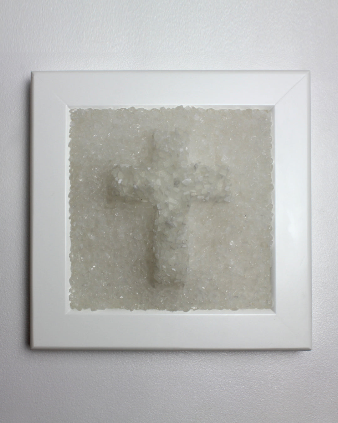 Delicate Selenite Crucifix on a bed of Clear Quartz